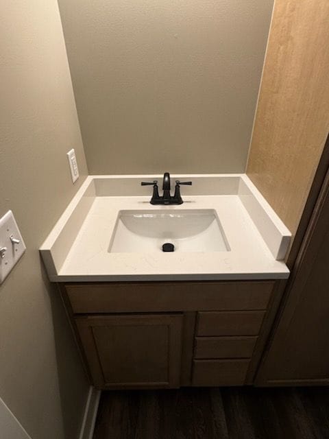 bathroom featuring vanity and wood finished floors