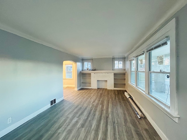 unfurnished living room featuring hardwood / wood-style flooring, a baseboard radiator, and ornamental molding