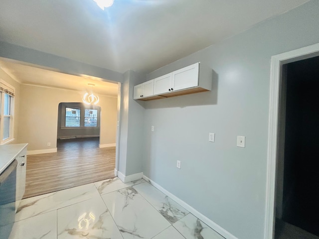 kitchen featuring white cabinetry and dishwasher