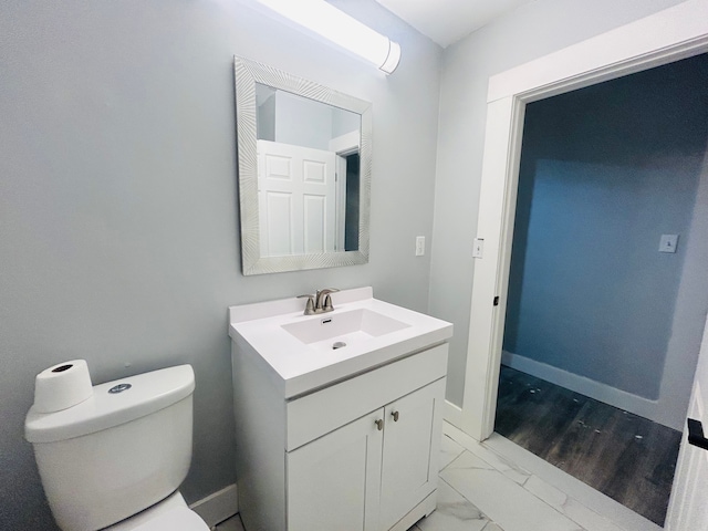 bathroom with toilet and vanity