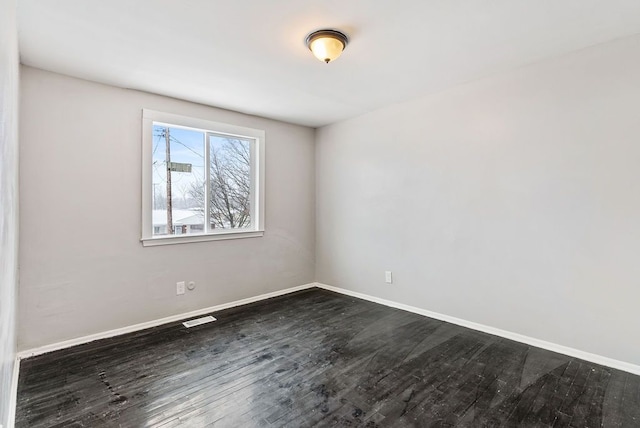 unfurnished room featuring dark hardwood / wood-style floors