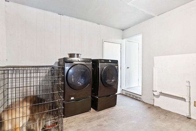 washroom featuring washer and dryer