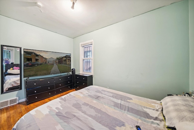 bedroom with wood-type flooring