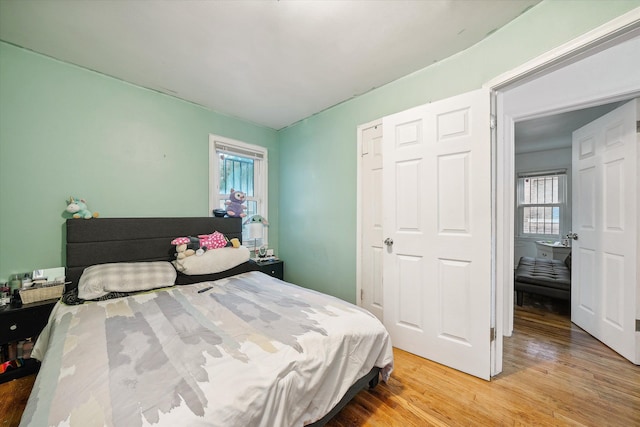 bedroom with hardwood / wood-style floors