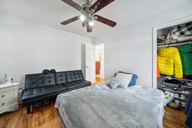 bedroom with ceiling fan and dark hardwood / wood-style floors