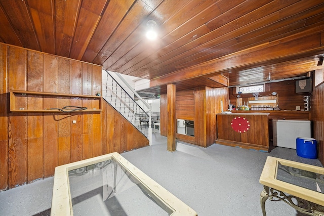 interior space with refrigerator, wooden ceiling, and wood walls