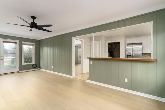 interior space with ceiling fan and light wood-type flooring