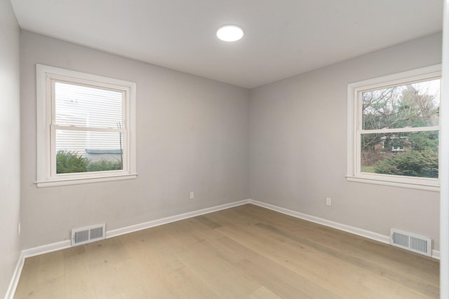 unfurnished room featuring light hardwood / wood-style flooring