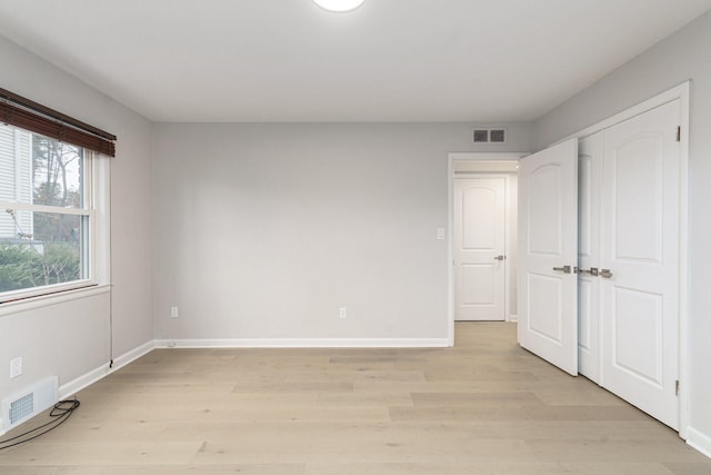 unfurnished bedroom with light hardwood / wood-style flooring