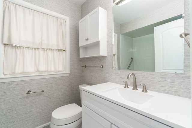 bathroom with vanity and toilet