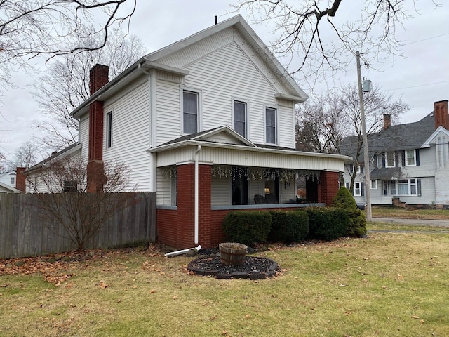 401 S Nottawa St, Sturgis, MI 49091 - view of home's exterior featuring a porch, a chimney, and brick siding