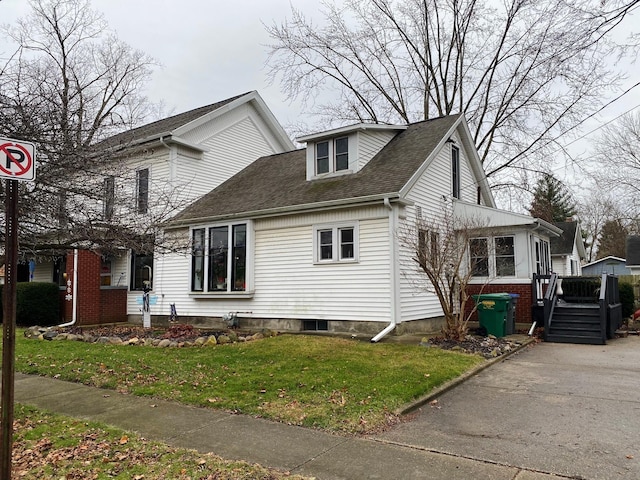 401 S Nottawa St, Sturgis, MI 49091 - view of home's exterior with a lawn and roof with shingles