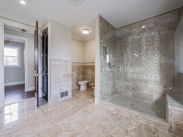 bathroom featuring a shower with shower door, ornamental molding, a bidet, and tile walls