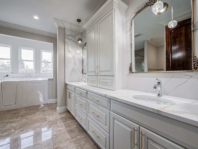 bathroom featuring vanity, crown molding, and a bath