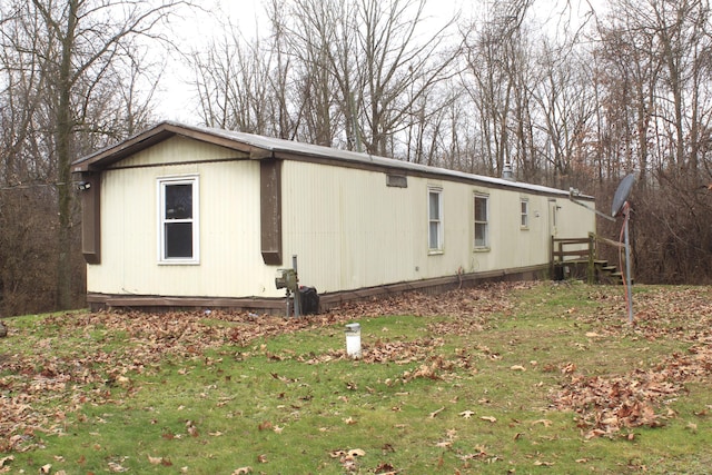 view of home's exterior with a lawn