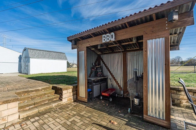 view of patio with a shed