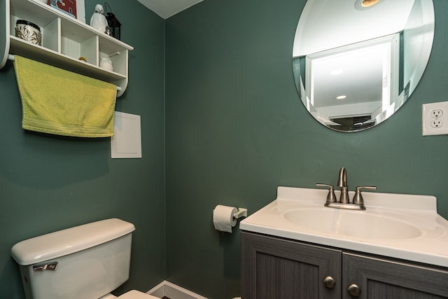 bathroom featuring vanity and toilet