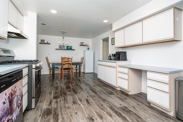 kitchen featuring hanging light fixtures, stainless steel range with gas cooktop, and white cabinets