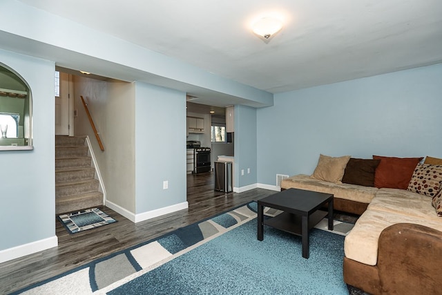 living room with dark hardwood / wood-style flooring