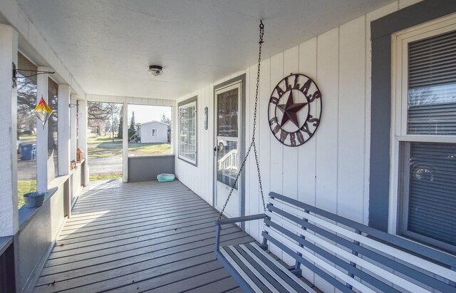 118 S Railroad St, Allen, MI 49227 - wooden terrace with covered porch