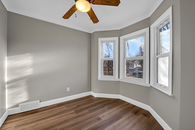 unfurnished room featuring ceiling fan and hardwood / wood-style floors