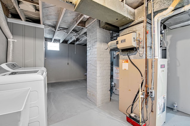 basement featuring heating unit and independent washer and dryer