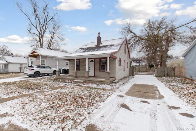 1597 W Saratoga St, Ferndale, MI 48220 - bungalow featuring covered porch and a chimney