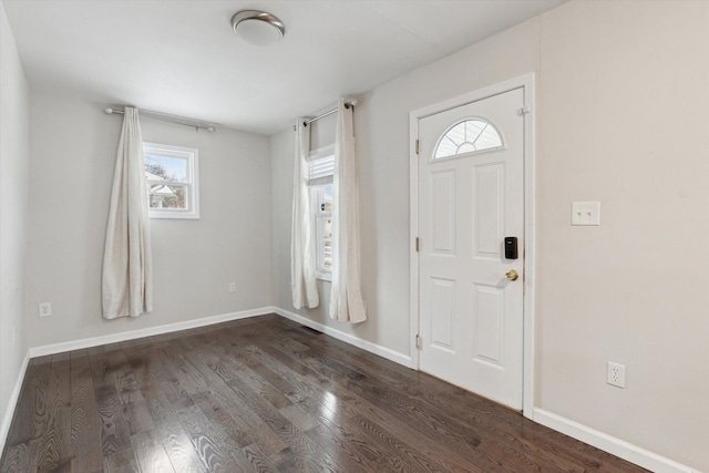 entrance foyer featuring dark hardwood / wood-style floors