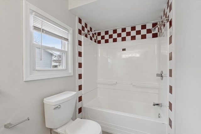 bathroom with toilet and washtub / shower combination