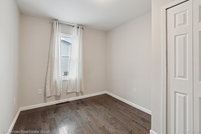 1597 W Saratoga St, Ferndale, MI 48220 - spare room featuring dark wood-style floors and baseboards