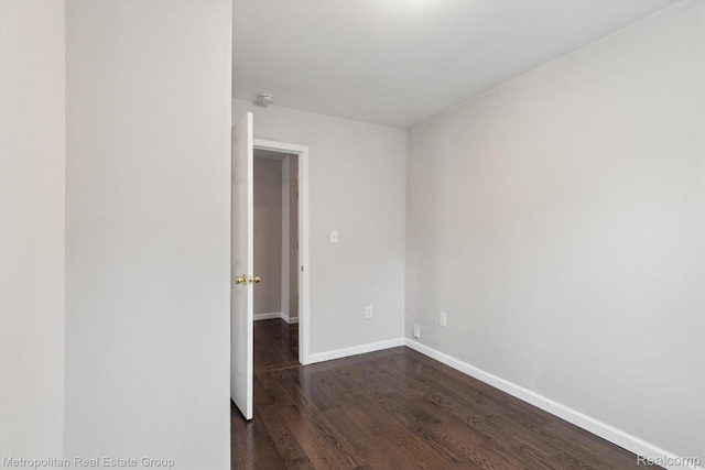 1597 W Saratoga St, Ferndale, MI 48220 - empty room featuring dark wood-style floors and baseboards
