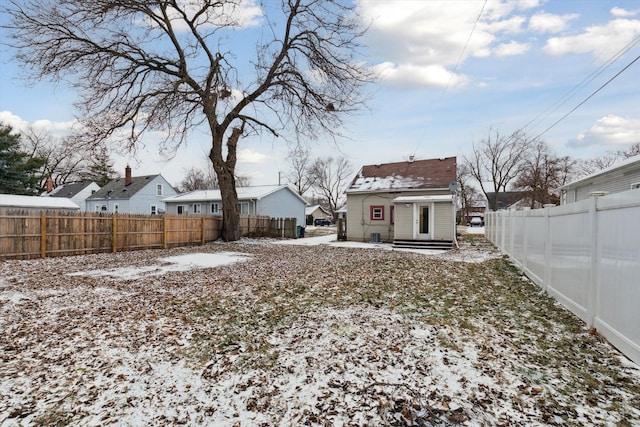 view of yard layered in snow