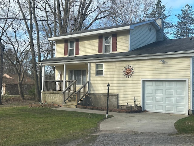 view of front of property with a garage, covered porch, and a front yard