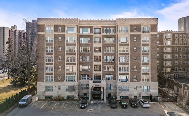 view of building exterior featuring uncovered parking