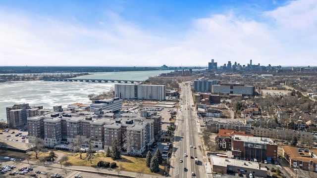 birds eye view of property featuring a view of city and a water view