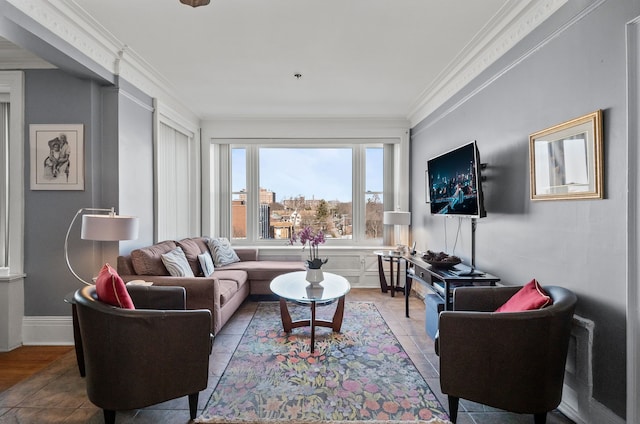 living room with ornamental molding and baseboards