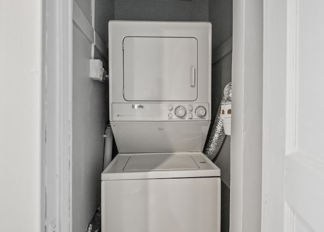 laundry room with stacked washer and clothes dryer