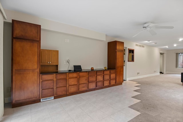 interior space with ceiling fan