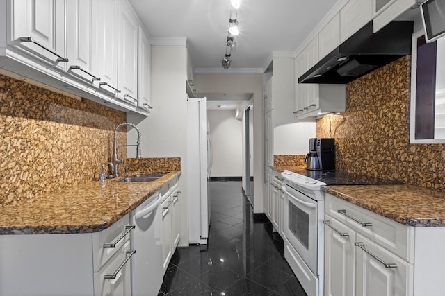 kitchen with white appliances, exhaust hood, dark stone counters, white cabinets, and sink