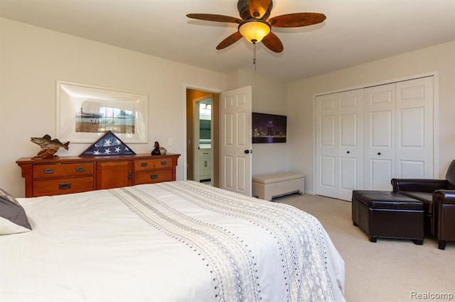 bedroom featuring light carpet, a closet, and ceiling fan