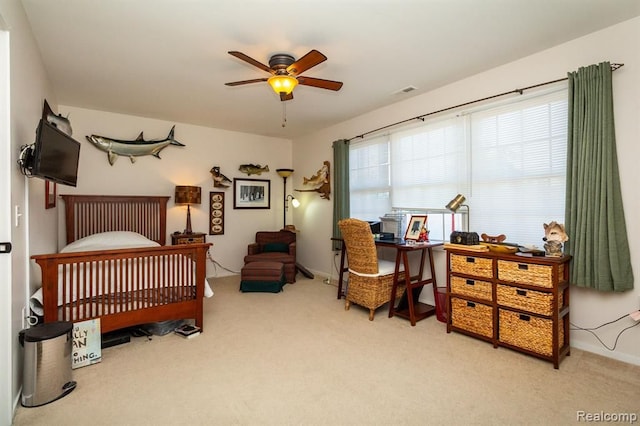 carpeted bedroom featuring ceiling fan