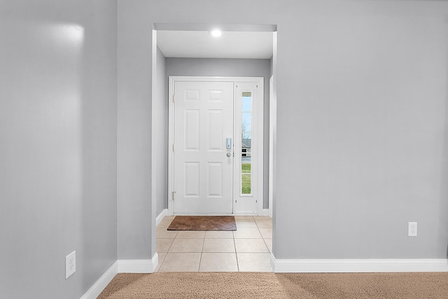 foyer entrance featuring light tile patterned floors