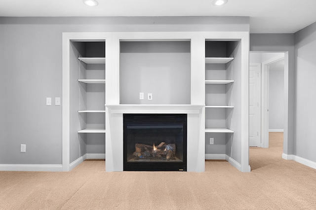 unfurnished living room featuring carpet flooring