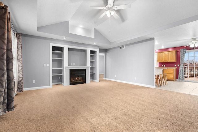 unfurnished living room with light carpet, built in features, ceiling fan, and lofted ceiling