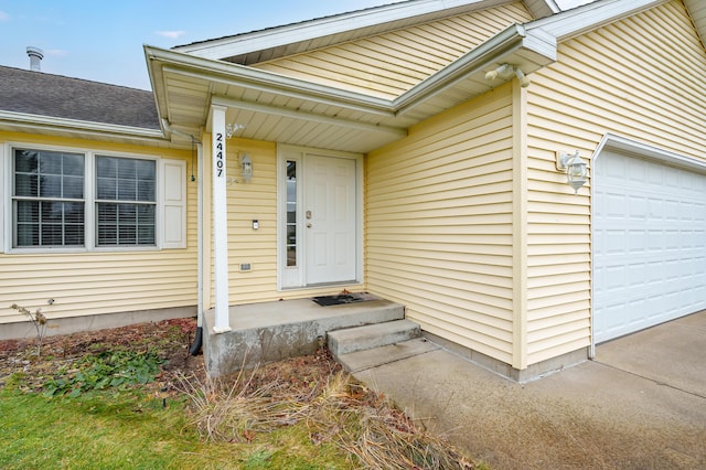 property entrance with a garage