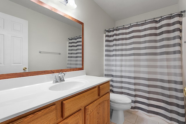 bathroom featuring tile patterned floors, vanity, and toilet