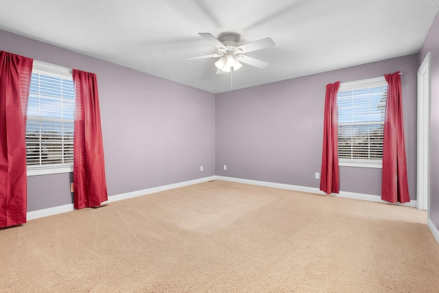 empty room featuring ceiling fan and carpet floors