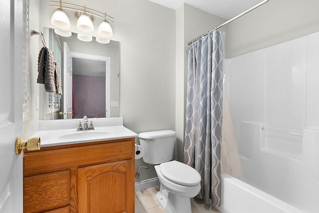 full bathroom featuring tile patterned floors, vanity, toilet, and shower / bath combo with shower curtain