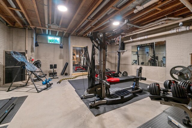 210 E Mcneil St, Corunna, MI 48817 - exercise area with brick wall