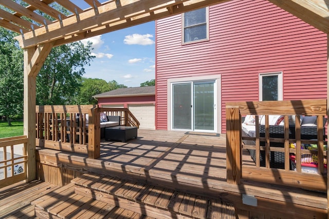 wooden deck featuring a pergola and an outdoor hangout area